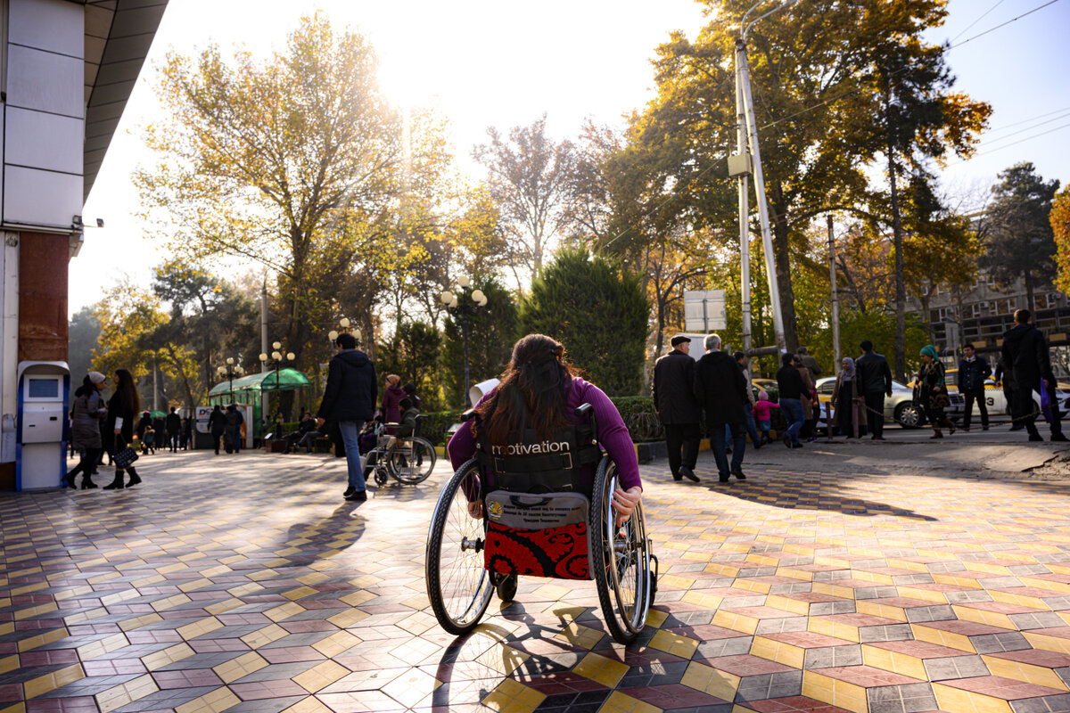 Patient (WHO Study Case) in her wheelchair within the urban environment of the city of Dushanbe in Tajikistan. Photo: © WHO/ NOOR/ Sebastian Liste