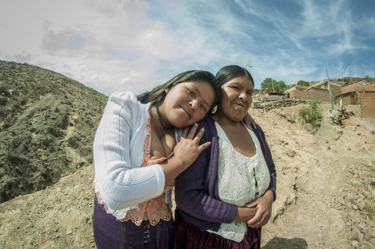 Sabina Colque Espiritu, a 18 year old young mother of a newborn and her mother Leandra. After she participated in the Wawaspaq program she has an affectionate relationship with her mother Leandra who supported her during and after the pregnancy, Sucre, Bolivia. Photo: © CBM<br>