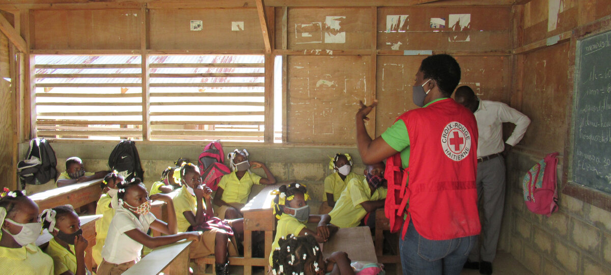 Giving health education in schools in Haiti. Photo: © Swiss Red Cross<br>