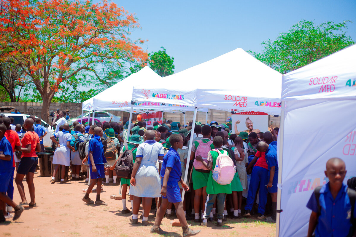 Adolescents crowded around the tents to be part of the discussions about their health and wellbeing. Photo: © Winston Musorowembudzi